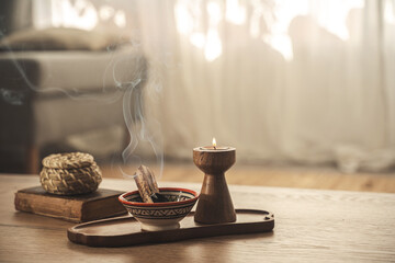 Burning Palo Santo and Candle on Wooden Tray for Relaxation and Meditation