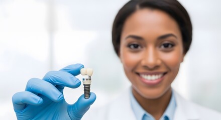 Fototapeta premium Smiling dentist displays a dental implant, showcasing its precise craftsmanship and promising a confident smile restoration for patients seeking advanced dental care.