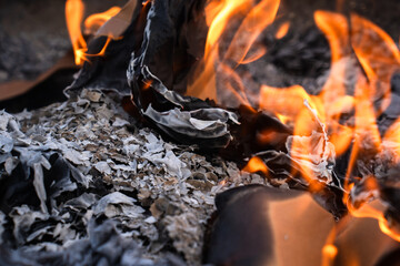 Burning  Paper Packaging in Flames and Ashes