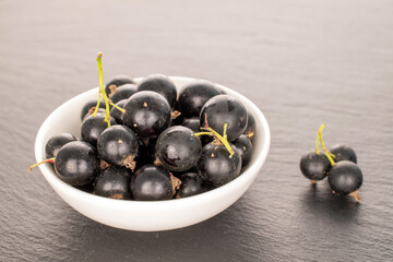 Sweet blackcurrant, macro, on slate stone.