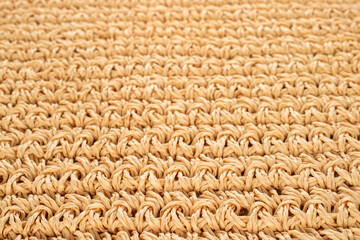 Straw mat woven from straw, close-up.