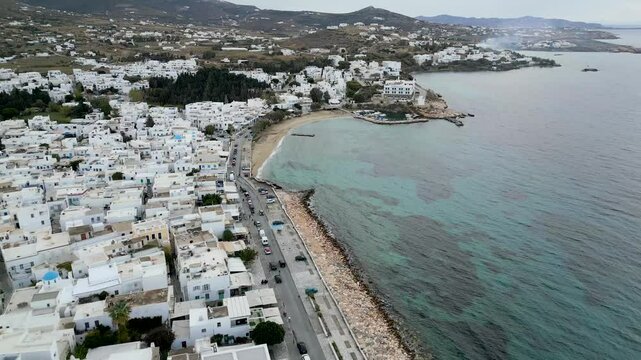 Aerial view of white buildings along coastline, Greece.