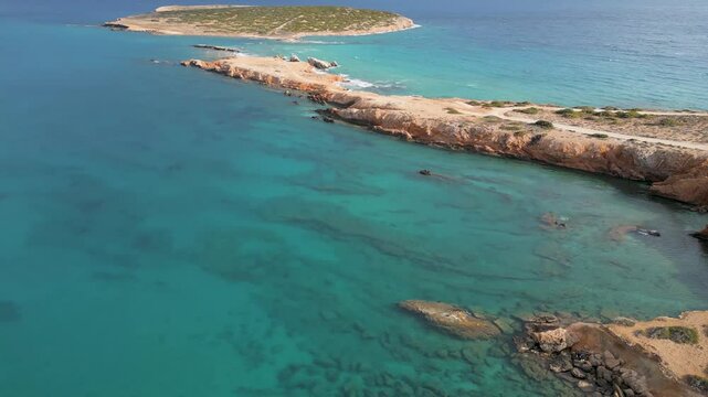 Aerial view of coastline and turquoise waters, Greece.