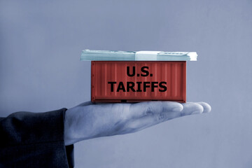 U.S. Tariffs effect concept; Shipping container and banknote on hand
