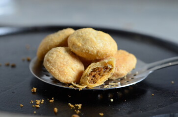 Crispy Indian dal kachori – small round deep-fried snack filled with spiced lentil mixture, served as popular tea-time or street food snack – traditional North Indian namkeen
