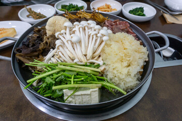 A Hearty Korean Hot Pot Brimming with Fresh Mushrooms and Rich, Savory Broth