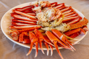 Boiled snow crab. Steamed snow crab.Close-up of the tongs and chewy legs of freshly steamed hot snow crab.