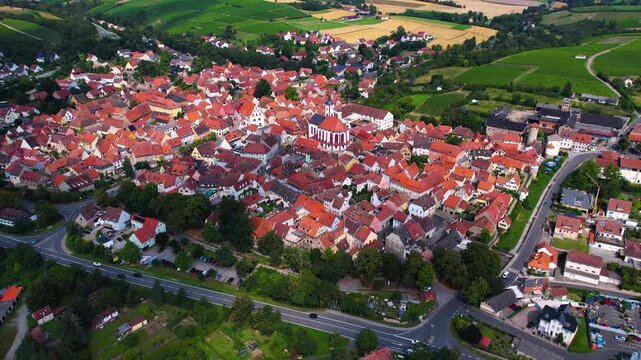 A panorama Aerial view around the old town of the city Dettelbach on an early summer day in Germany.	