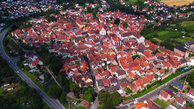 A panorama Aerial view around the old town of the city Dettelbach on an early summer day in Germany.	