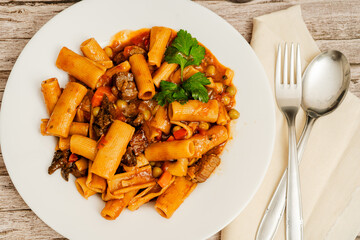 Delicious pasta with beef and vegetables enjoying a hearty meal