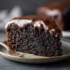 Delicious Slice of Rich Chocolate Cake with Decadent Chocolate Frosting