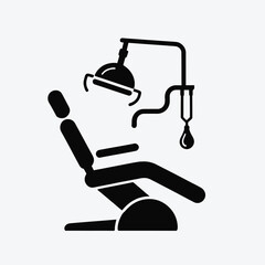 Black silhouette of a dental chair with a lamp and suction tube