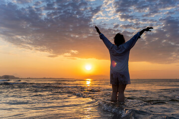 Embracing tranquility at sunrise on the beach