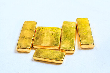 Pure ingots gold on the white background