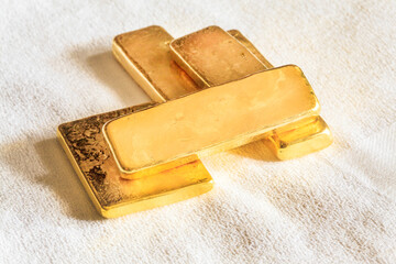 Pure ingots gold on the white background
