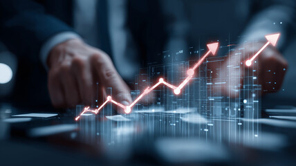 Person in suit is analyzing data with futuristic digital graph showing upward trends, symbolizing growth and success in business strategy