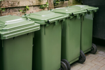 Colorful recycling bins on city street
