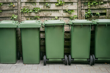 Colorful recycling bins on city street