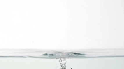 Slow motion strawberry splash into clear water - Powered by Adobe