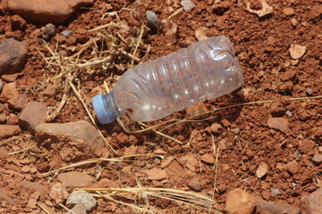 A plastic bottle lying on the ground