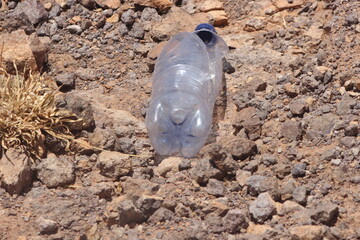 A plastic bottle lying on the ground