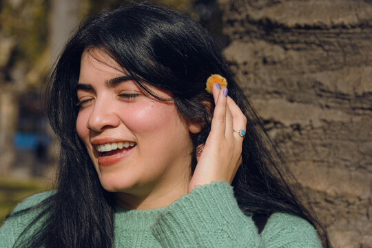 Portrait of a beautiful happy Venezuelan woman in the park