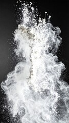 Obraz premium White Flour Explosion Against Black Background