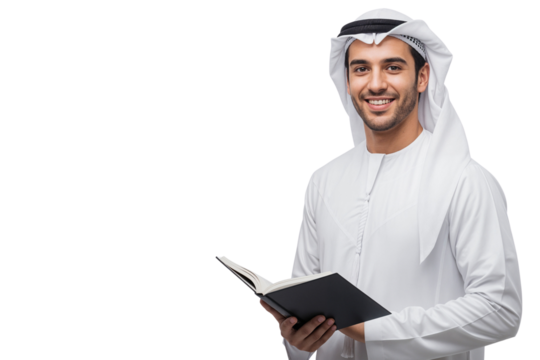 Smiling young Arab man in traditional clothes holding an open book and looking at the camera. Studio shot with ample copy space - Powered by Adobe