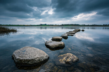 A rocky shoreline with a body of water in the background