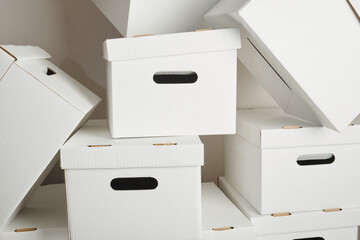 pile of white cardboard boxes with slots for holding, storage boxes mock up