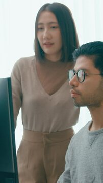 Vertical Screen : Group Adult Asia male female freelance meeting write prompt AI bot app program nomad, video game, talk strategy, discuss plan, user interface, designer, big data on desktop computer.