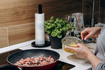 Step by step the process of cooking Italian pasta carbonara in spaghetti, add sauce with fried...
