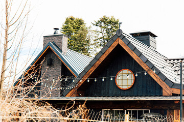 Charming mountain home with unique architecture and exterior details in a serene landscape