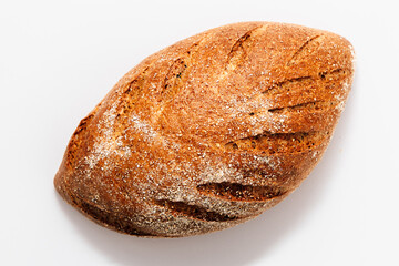 Freshly baked whole grain bread with a crusty exterior from a bakery in the morning hours
