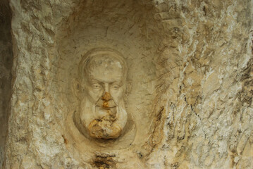 In the province of Pescara, Abruzzo, in the locality of Roccamorice, carved into the rock face, you can observe statues and faces of saints