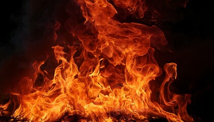 Fototapeta premium fiery orange and red flames engulfing dark background intense burning embers blaze flames wild
