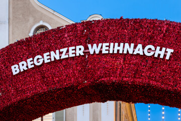 Red Christmas arch with the inscription “Bregenzer Weihnacht” as a festive entrance to the...