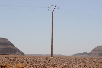 A view of an electric pole with line wire