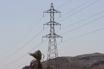 A view of an electric pole with line wire