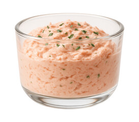 A small glass vessel containing a delicate crab mousse, suitable for a seaside cottage luncheon.