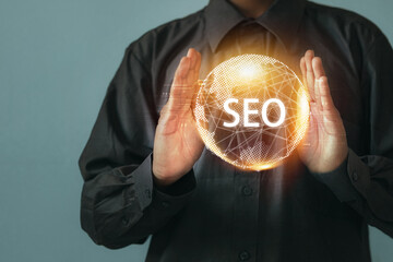 Businessman Holding SEO Digital Sphere, Search Engine Optimization Concept