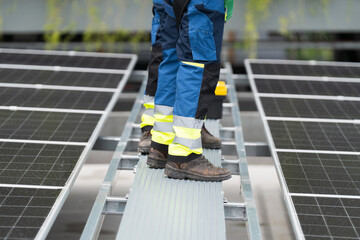 Solar panel, Solar system. Team of engineers or technicians maintaining and repairing solar power...