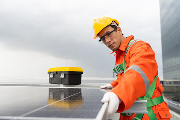 Solar panel rooftop, Rooftop solar power. Engineer or technician inspecting installation quality of solar power systems on rooftop of building. Male engineer checks solar panel on rooftop