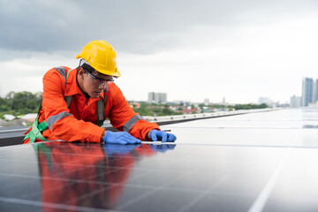 Solar panel rooftop, Rooftop solar power. Engineer or technician inspecting installation quality of solar power systems on rooftop of building. Male engineer checks solar panel on rooftop