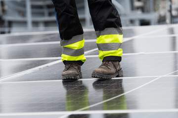 Solar panel rooftop, Rooftop solar power. Engineer or technicians maintaining and repairing solar panel on rooftop of building. Male engineer install solar cell on rooftop