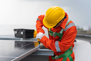 Solar panel rooftop, Rooftop solar power. Engineer or technicians maintaining and repairing solar power systems on rooftop of building. Male engineer install solar cell on rooftop