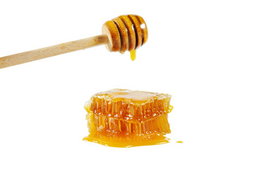 Honeycombs with honey spoon isolated on white background.