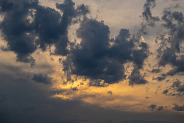 Dark clouds and fiery sunset sky before a storm