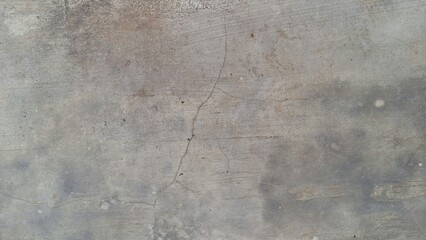 Grunge concrete texture with distressed weathered stone surface, aged wall background with rough cement patterns and abstract industrial texture design element
