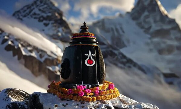 Sacred Stone Shivling in Snowy Himalayan Mountain Landscape with Spiritual Blooms